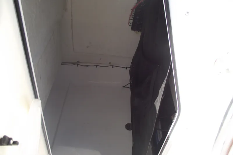 Slide: The Image of Interior storage compartment of 2016 Sportsman Open 212 Center Console boat. - 24
