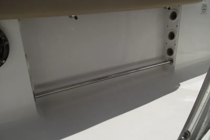 Slide: The Image of 2016 Sportsman Open 212 Center Console interior detail with rod holders and storage space. - 25