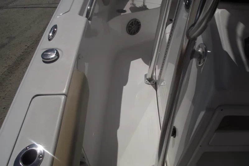 Slide: The Image of 2016 Sportsman Open 212 Center Console boat interior with stainless steel railings. - 28