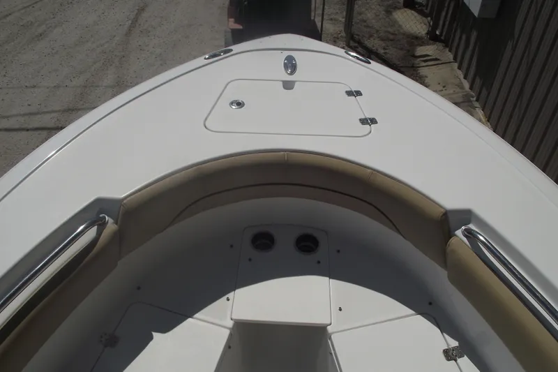 Slide: The Image of 2016 Sportsman Open 212 Center Console boat, featuring spacious bow seating and storage. - 6