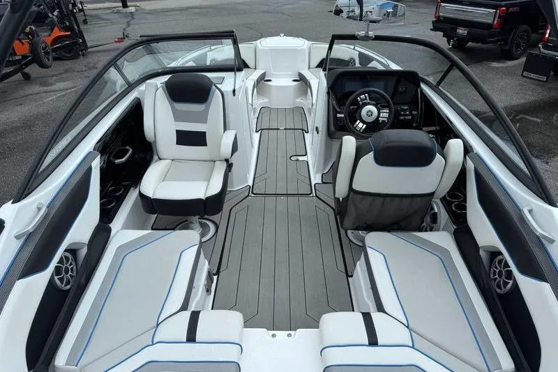 Slide: The Image of 2021 Yamaha Boats 212X interior with sleek seating and modern dashboard design. - 11