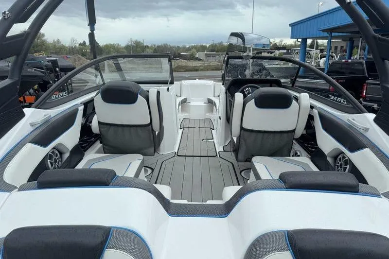 Slide: The Image of 2021 Yamaha Boats 212X interior with sleek seating and modern design. - 12