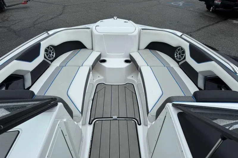 Slide: The Image of 2021 Yamaha Boats 212X interior with spacious seating and modern design. - 13