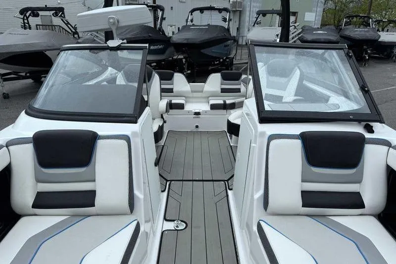Slide: The Image of 2021 Yamaha Boats 212X interior with sleek seating and modern design. - 18