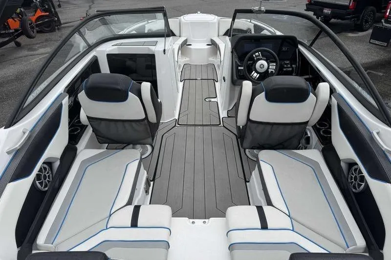 Slide: The Image of 2021 Yamaha Boats 212X interior with sleek seating and modern dashboard design. - 5