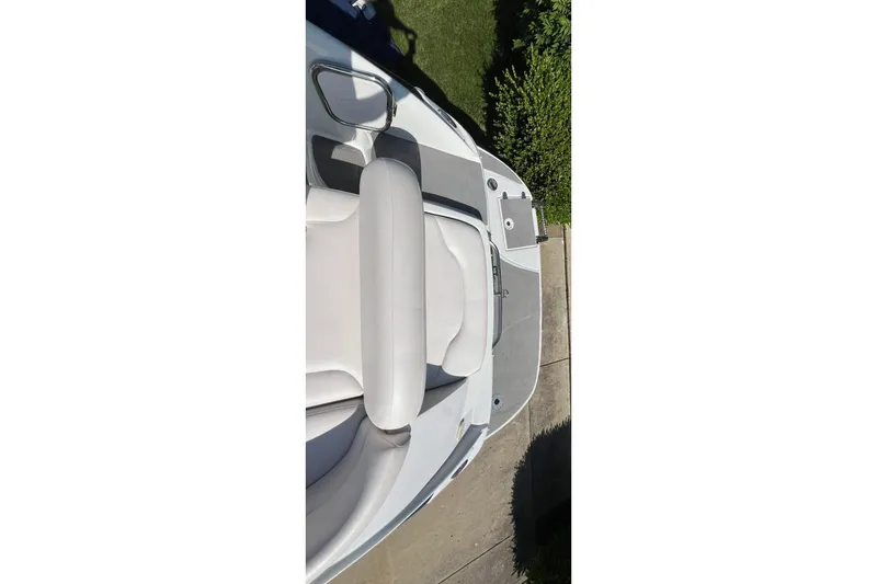Slide: The Image of 2006 Crownline 252 EX boat interior with seating and deck view. - 11