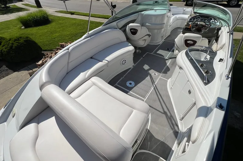 Slide: The Image of 2006 Crownline 252 EX boat interior with white seating and modern dashboard. - 8