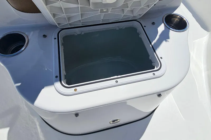 Slide: The Image of Open storage compartment on a 2019 Sea Pro 208 Bay boat with cup holders. - 11
