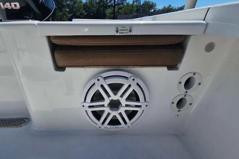 Slide: The Image of 2019 Sea Pro 208 Bay boat interior with speaker and cushioned seating. - 15