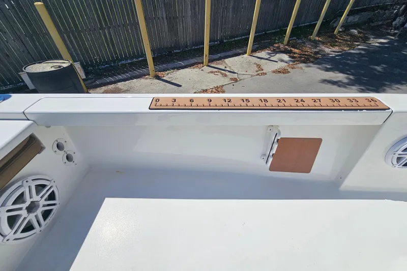 Slide: The Image of 2019 Sea Pro 208 Bay boat interior with ruler and speaker detail. - 17