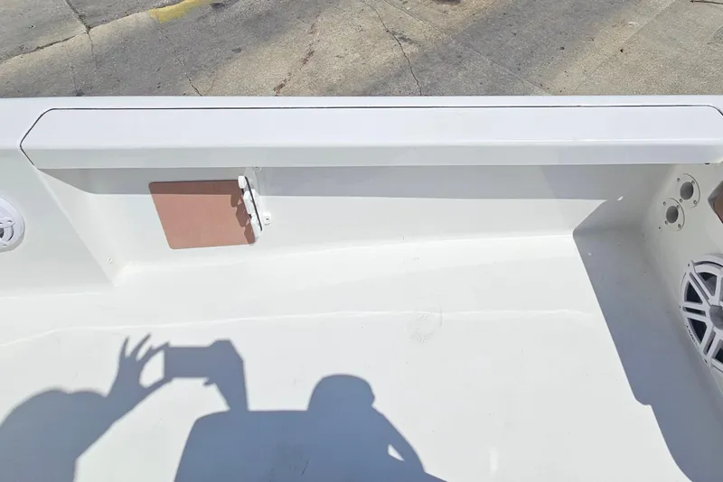 Slide: The Image of 2019 Sea Pro 208 Bay boat interior with white deck and speaker detail. - 18