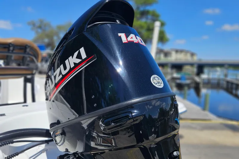 Slide: The Image of Suzuki 140 outboard motor on 2019 Sea Pro 208 Bay boat, dockside view. - 3