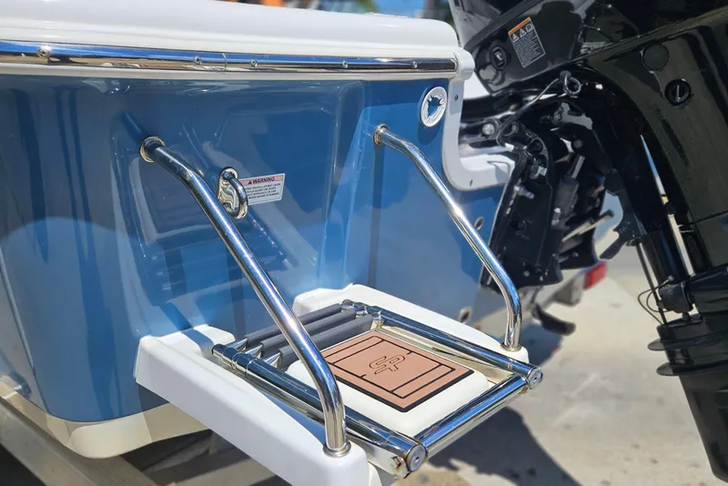 Slide: The Image of 2019 Sea Pro 208 Bay boat with stainless steel swim ladder and blue hull. - 4