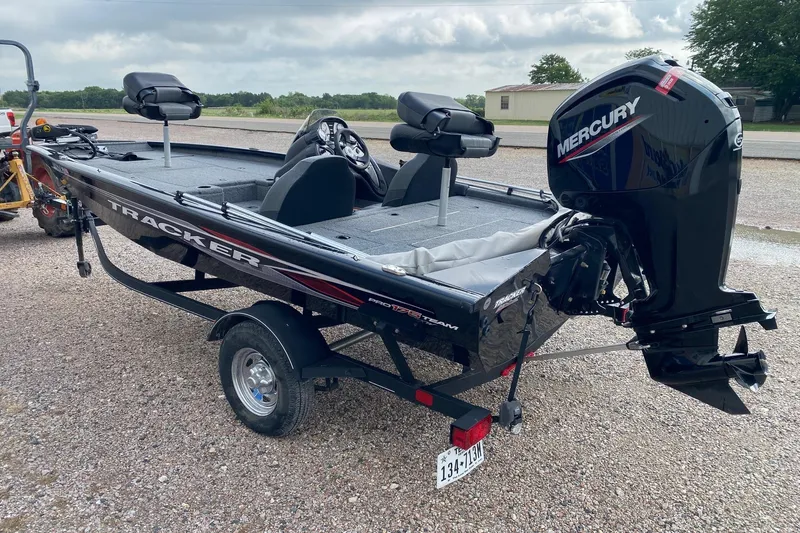 Slide: The Image of 2022 Tracker Pro Team 175 TXW boat with Mercury engine on a trailer. - 4