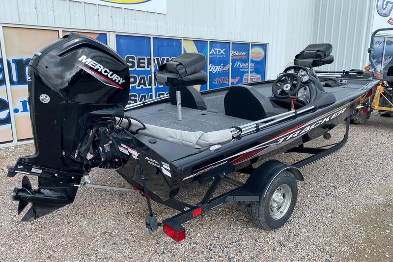 Slide: The Image of 2022 Tracker Pro Team 175 TXW fishing boat with Mercury outboard motor on trailer. - 5
