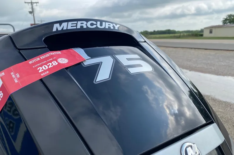 Slide: The Image of Mercury 75 outboard motor with 2028 registration sticker on Tracker Pro Team 175 TXW. - 6