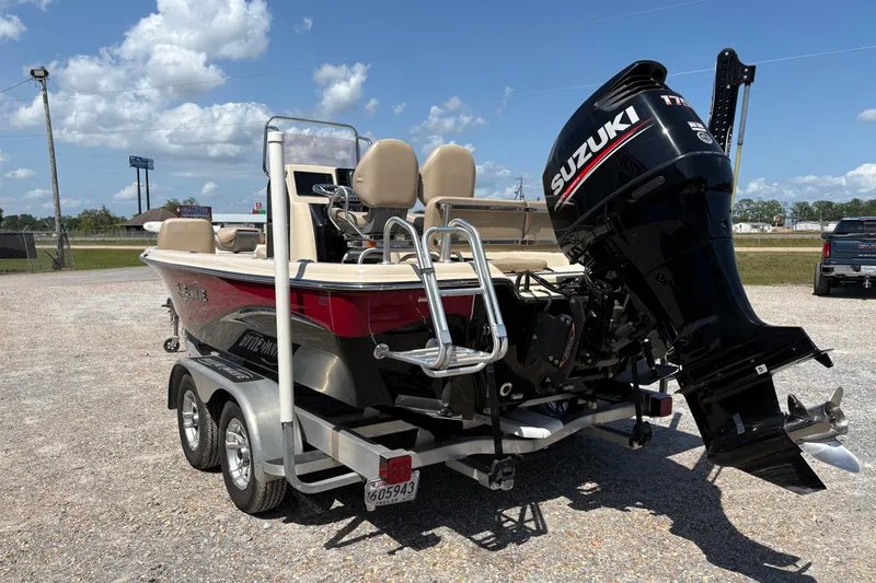 Slide: The Image of 2018 Blue Wave 2200 PureBay boat with Suzuki outboard motor on a trailer. - 4