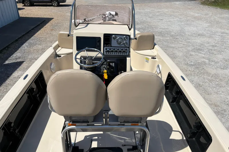 Slide: The Image of 2018 Blue Wave 2200 PureBay boat interior with dual seats and steering console. - 7