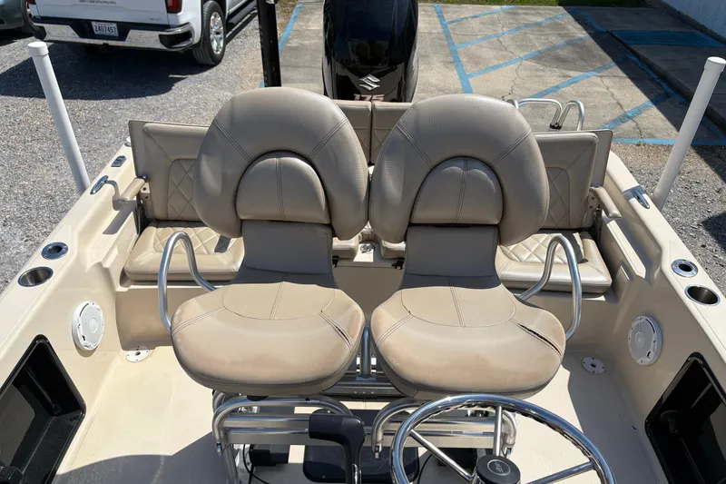 Slide: The Image of 2018 Blue Wave 2200 PureBay boat interior with dual seats and steering wheel. - 8