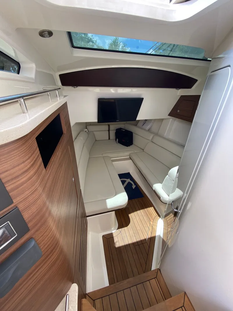 Slide: The Image of Interior of 2020 Boston Whaler 350 Realm with sleek seating area. - 16