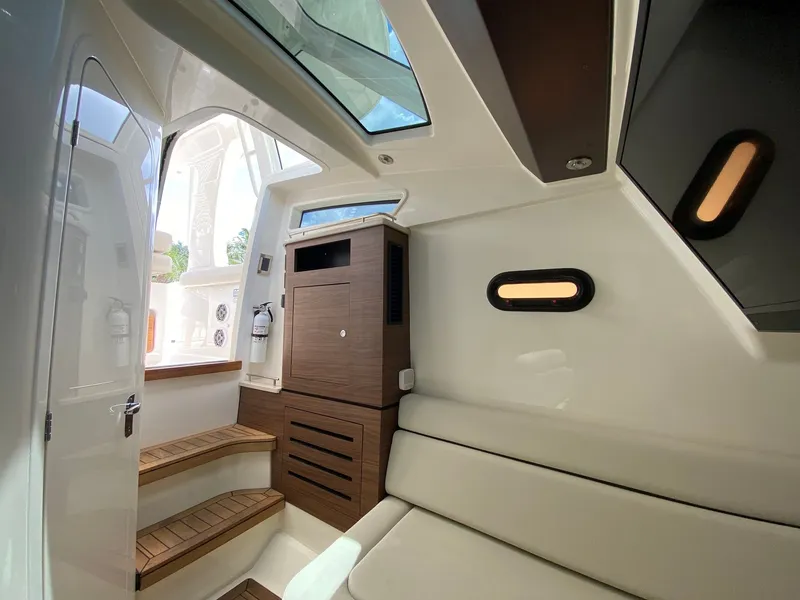 Slide: The Image of Interior of 2020 Boston Whaler 350 Realm with wood accents. - 19