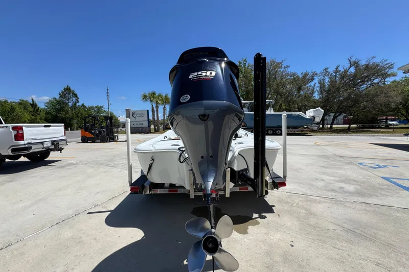 Slide: The Image of 2016 Yellowfin 21 Hybrid boat on trailer with powerful outboard motor. - 14