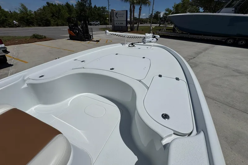 Slide: The Image of 2016 Yellowfin 21 Hybrid boat interior with seating and storage compartments. - 18