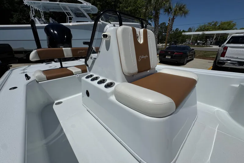 Slide: The Image of 2016 Yellowfin 21 Hybrid boat interior with brown and white seating, showcasing sleek design. - 27