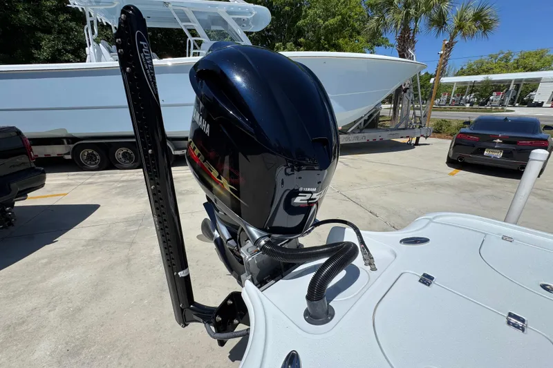 Slide: The Image of 2016 Yellowfin 21 Hybrid boat with Yamaha 250 outboard motor in a parking lot. - 36