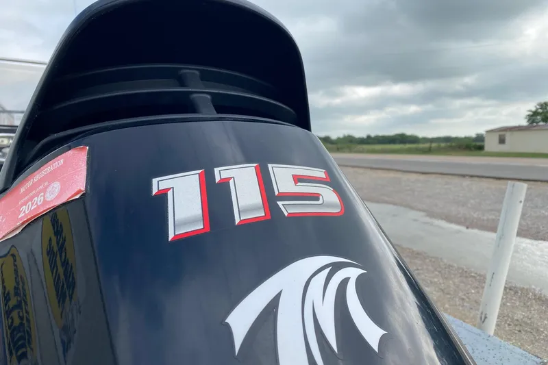 Slide: The Image of Close-up of a 2018 Xpress H20B Bay boat motor with registration sticker. - 4