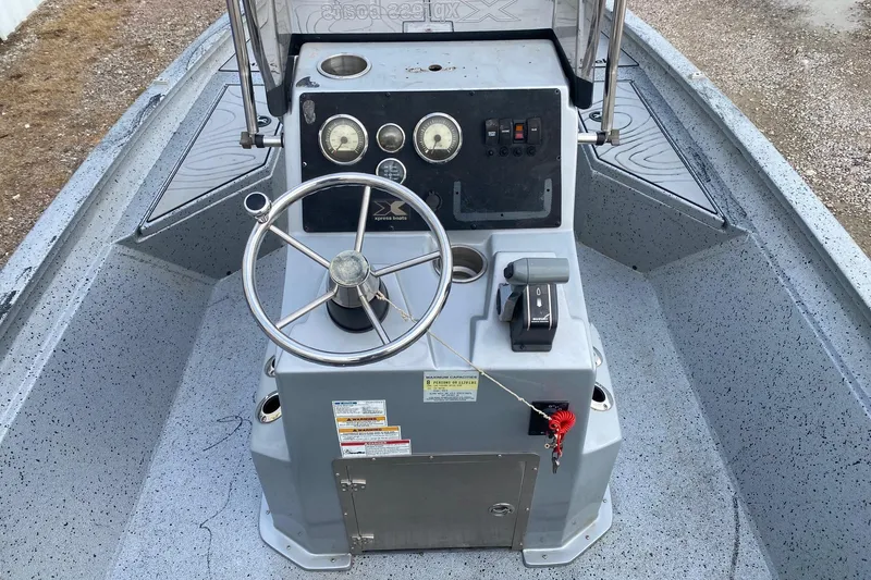 Slide: The Image of 2018 Xpress H20B Bay boat console with steering wheel and control panel. - 6