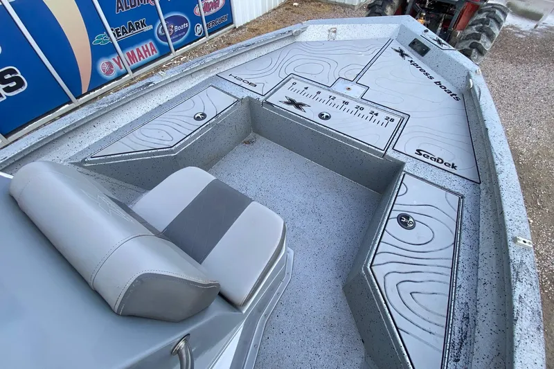 Slide: The Image of 2018 Xpress H20B Bay boat interior with SeaDek flooring and seating. - 7