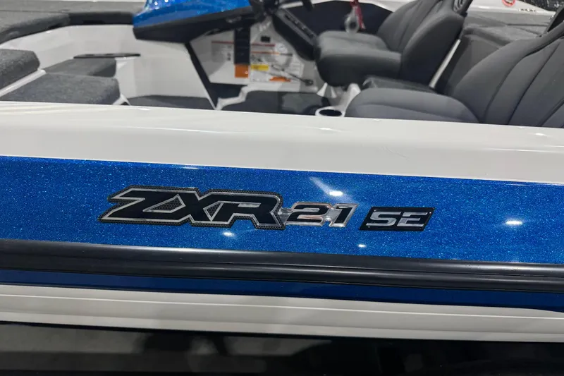 Slide: The Image of 2026 Skeeter ZXR21 SE boat interior with blue and white design. - 2