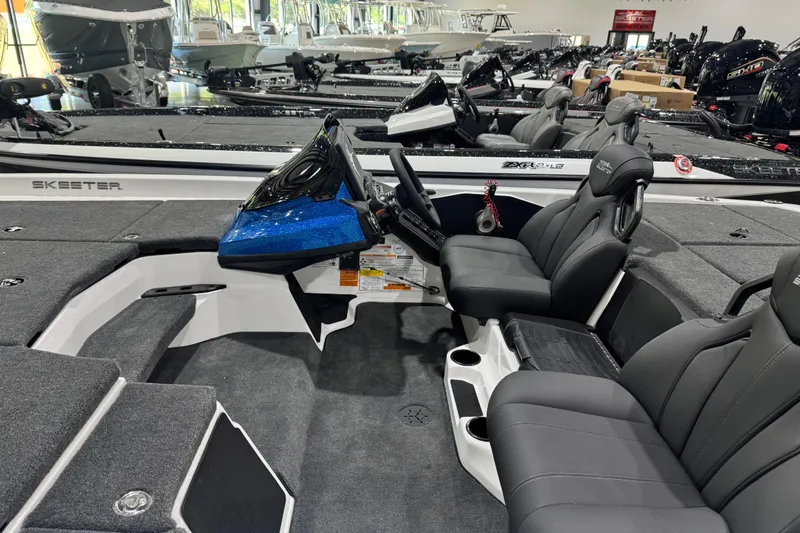 Slide: The Image of 2026 Skeeter ZXR21 SE boat interior with sleek seating and modern dashboard. - 7