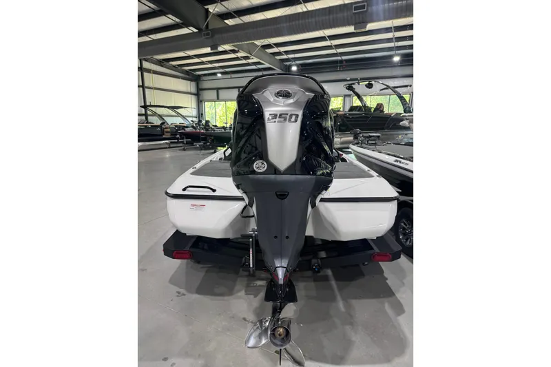 Slide: The Image of 2026 Skeeter ZXR21 SE boat with powerful 350 engine in showroom. - 9