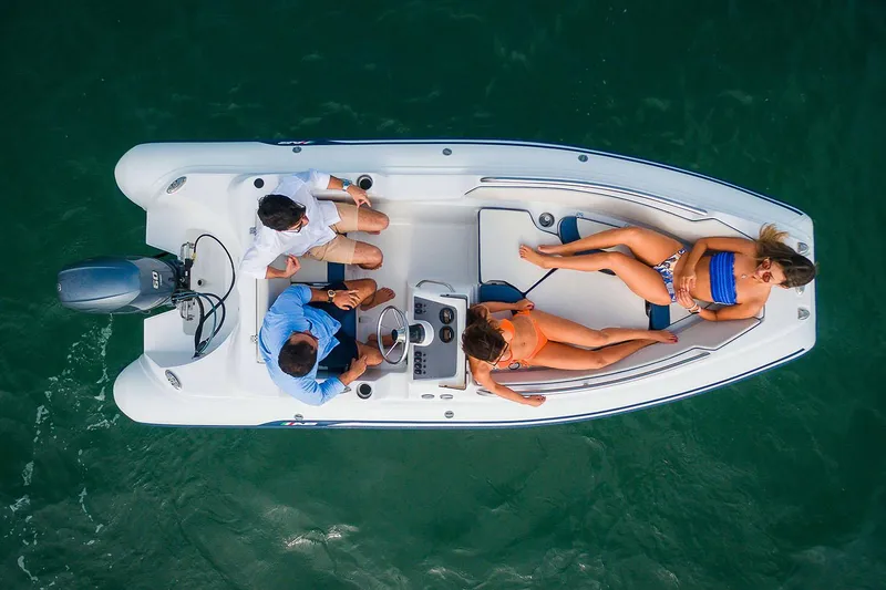 Slide: The Image of Manufacturer Provided Image: Aerial view of AB Inflatables Nautilus 15 DLX boat on water. - 2