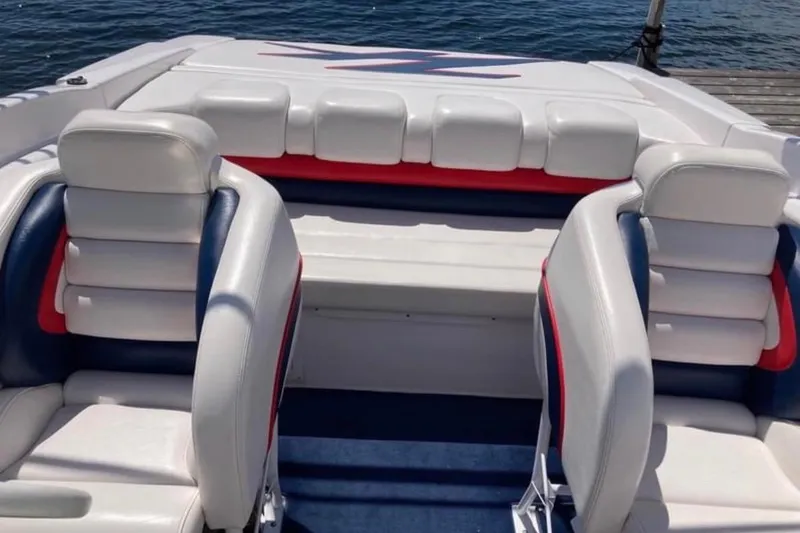 Slide: The Image of Interior of a 2001 Donzi 28 ZX boat with white and red seating. - 7
