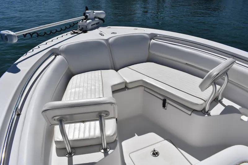 Slide: The Image of 2014 Sea Fox 226 Commander boat interior with white cushioned seating. - 10