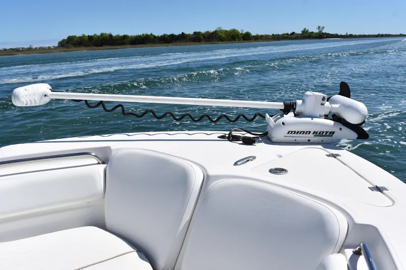Slide: The Image of 2014 Sea Fox 226 Commander boat with Minn Kota trolling motor on calm water. - 12