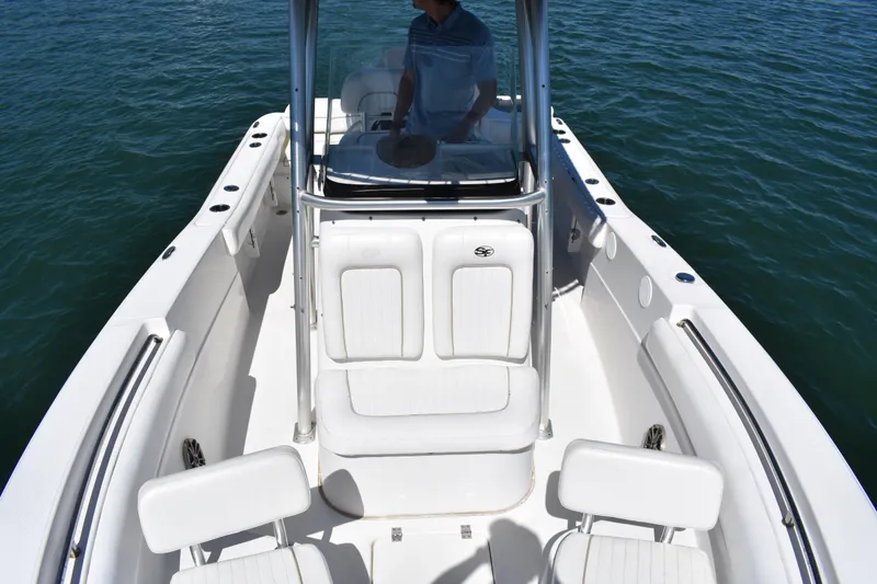 Slide: The Image of 2014 Sea Fox 226 Commander boat with white seating on calm water. - 13