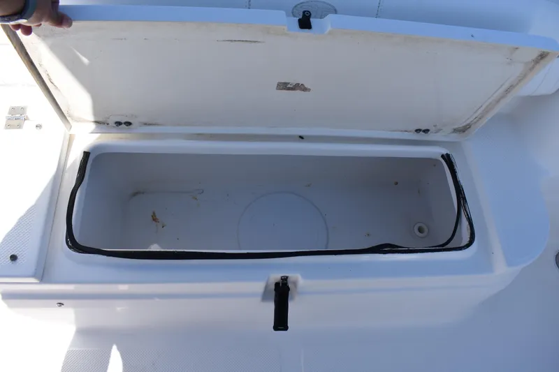 Slide: The Image of Open storage compartment on a 2014 Sea Fox 226 Commander boat. - 23