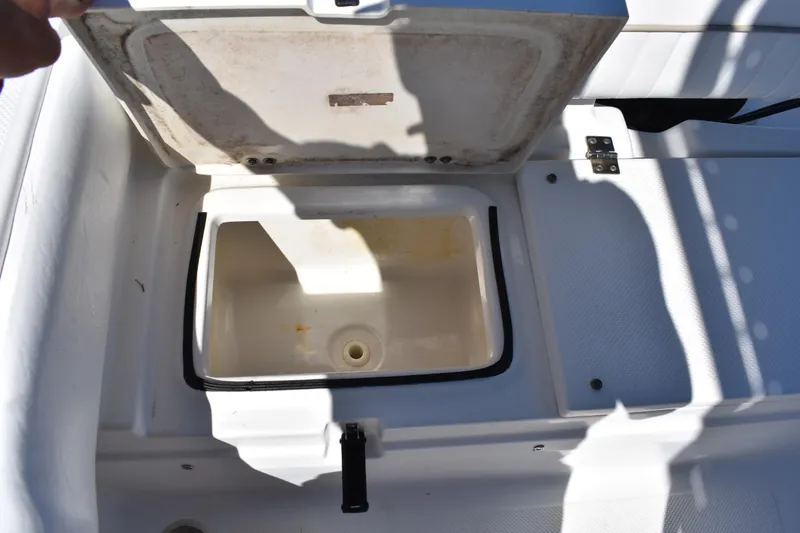Slide: The Image of Open storage compartment on a 2014 Sea Fox 226 Commander boat. - 24