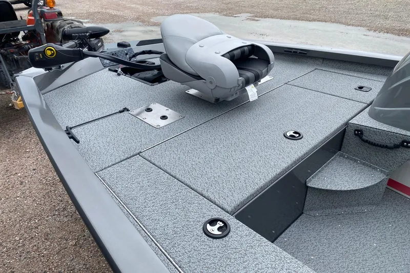 Slide: The Image of 2026 G3 Sportsman 1610 boat deck with seating and storage compartments. - 11