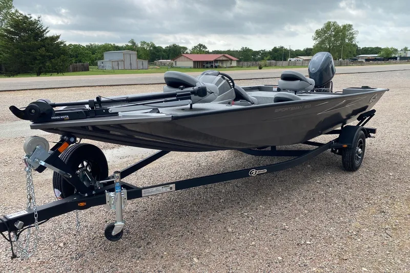 Slide: The Image of 2026 G3 Sportsman 1610 boat on trailer, parked outdoors. - 3
