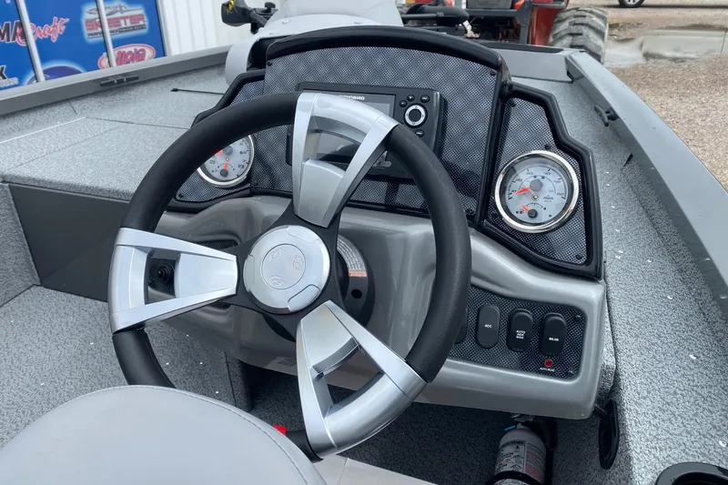Slide: The Image of Steering console of 2026 G3 Sportsman 1610 boat with gauges and controls. - 7