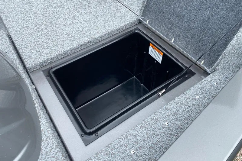 Slide: The Image of Open storage compartment on 2026 G3 Sportsman 1610 boat deck. - 9