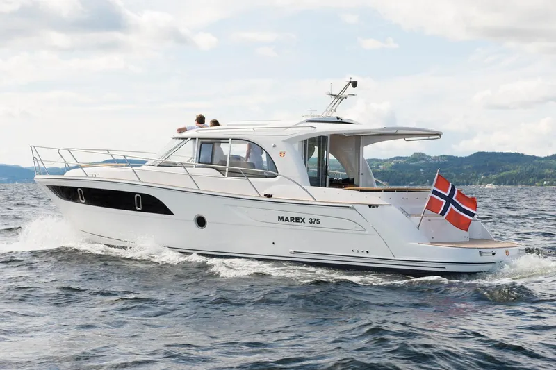 Slide: The Image of Manufacturer Provided Image: 2026 Marex 375 yacht cruising with Norwegian flag on open water. - 4