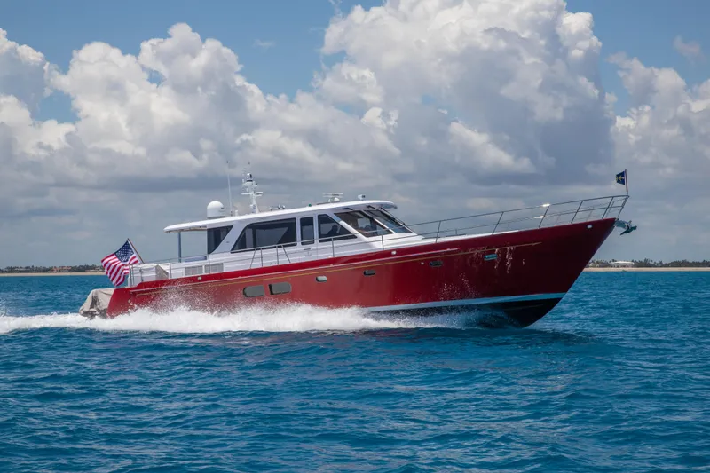 The Image of 2027 Hunt Yachts Ocean 63 Express cruising on blue ocean under cloudy sky. - 0