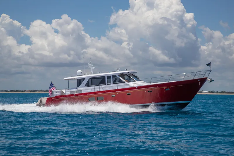 The Image of 2027 Hunt Yachts Ocean 63 Express cruising on blue ocean under cloudy sky. - 2