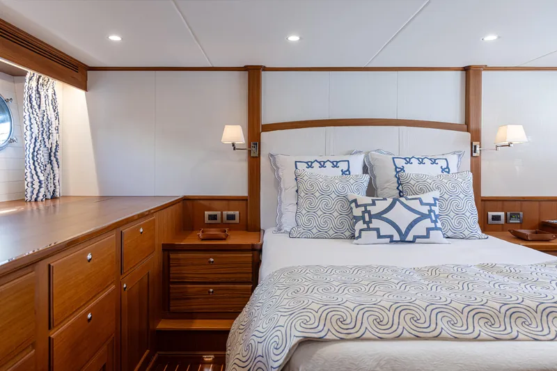 Slide: The Image of Luxurious bedroom interior of 2027 Hunt Yachts Ocean 63 Express with elegant wood finish. - 6